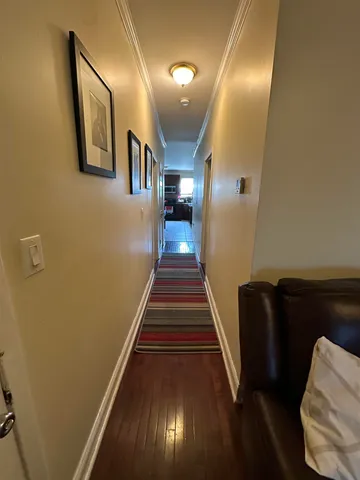 a bedroom with a bed closet and a flat tv screen