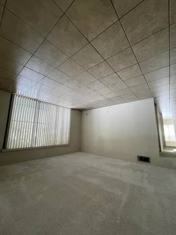 an empty room with a bathroom