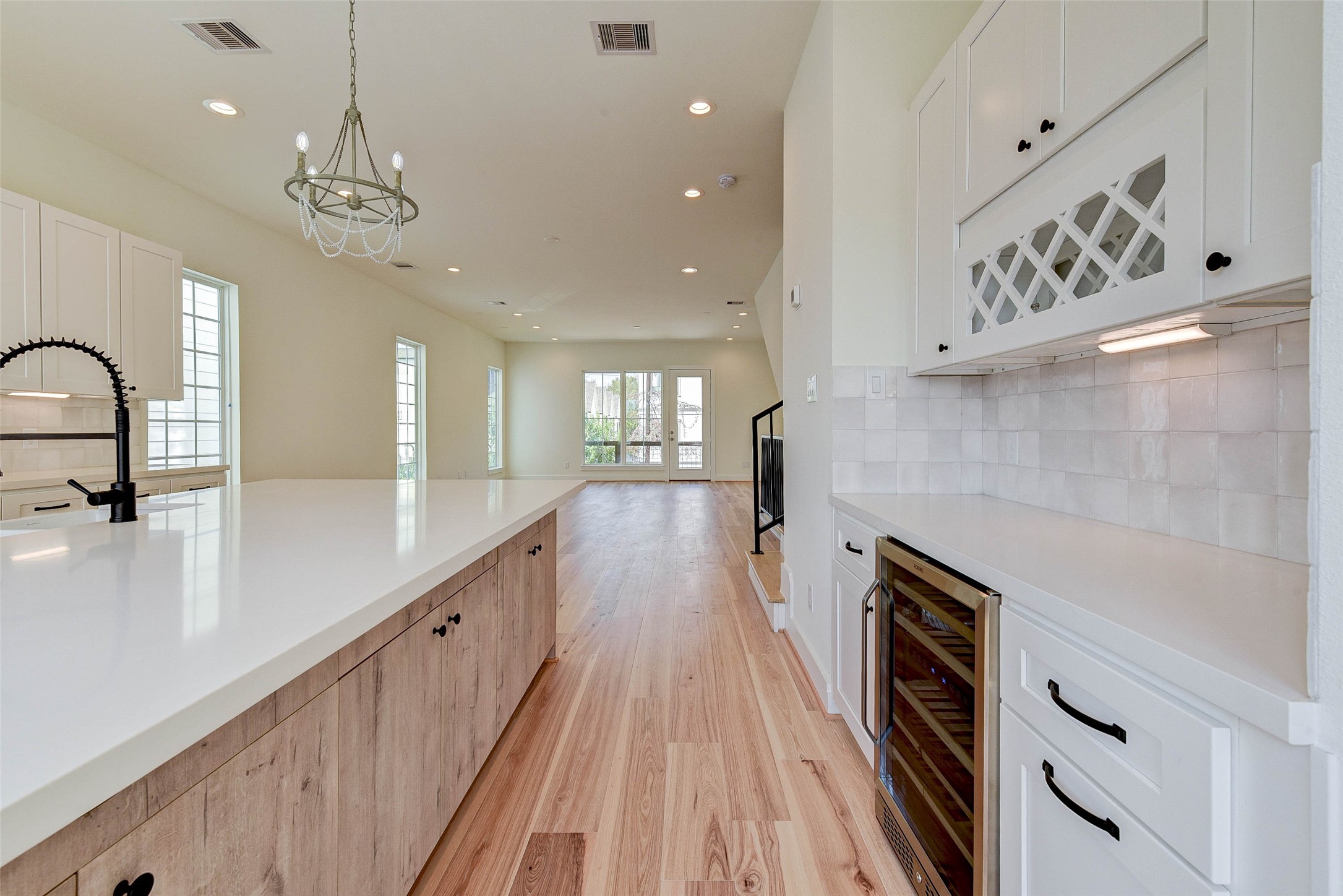 2516 Ohsfeldt Street Houston, TX 77008 - Photo 11 of 24 a kitchen with kitchen island a counter top space a sink stainless steel appliances and cabinets