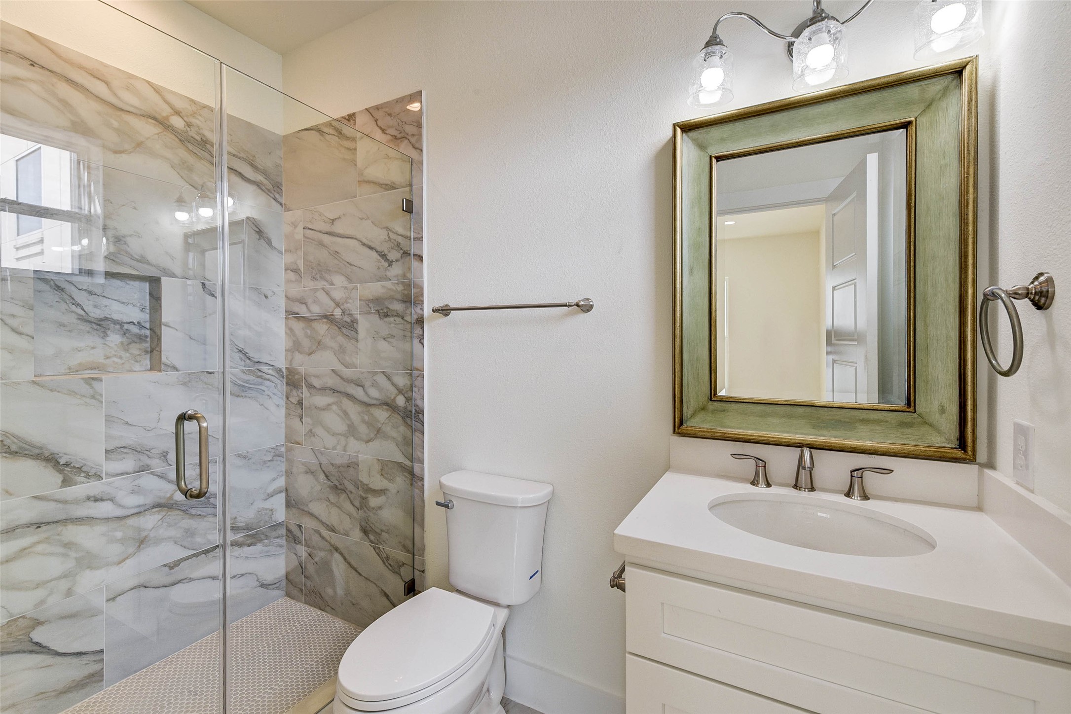 2516 Ohsfeldt Street Houston, TX 77008 - Photo 20 of 24 a bathroom with a sink a toilet and shower