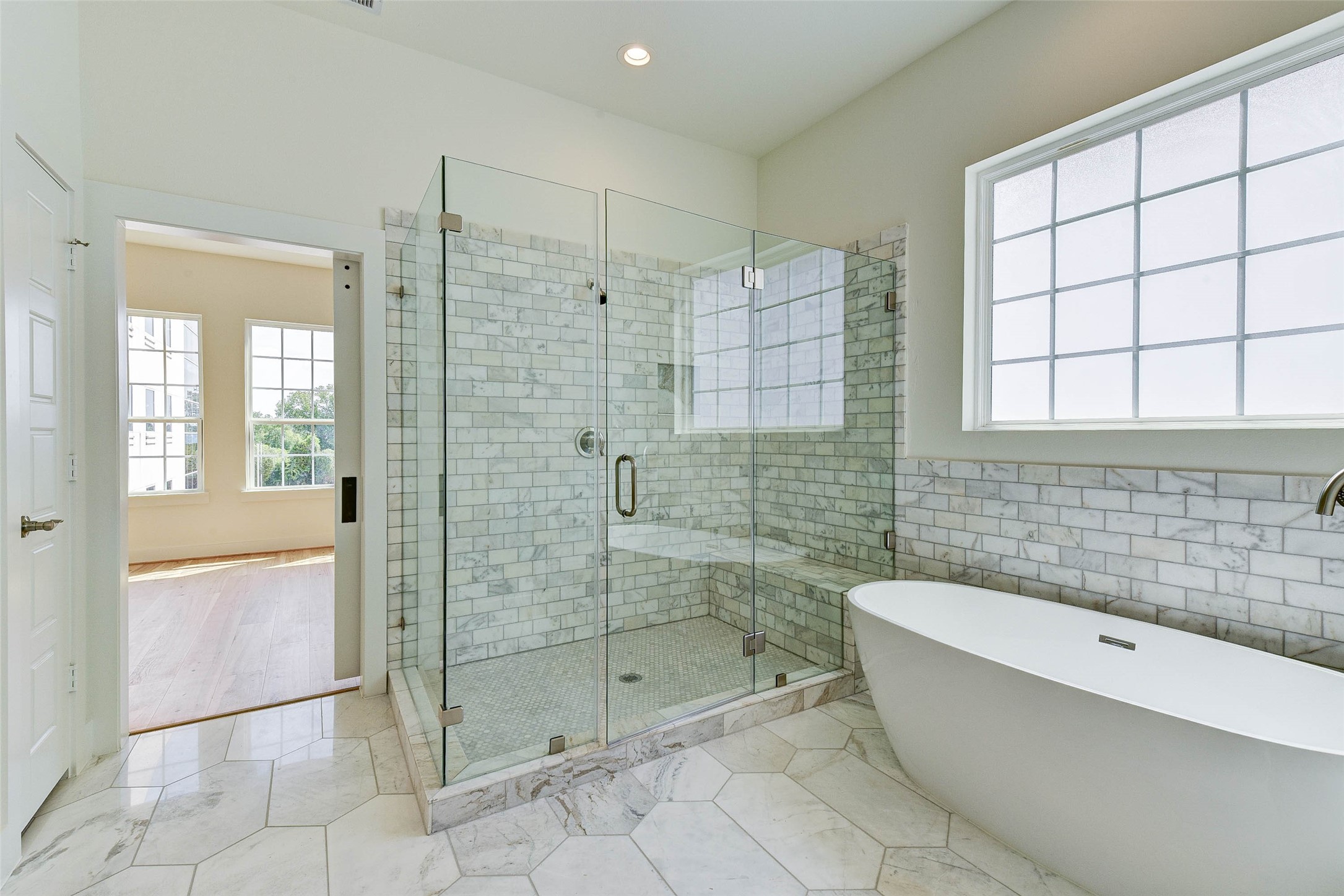 2516 Ohsfeldt Street Houston, TX 77008 - Photo 23 of 24 a bathroom with a bathtub and shower