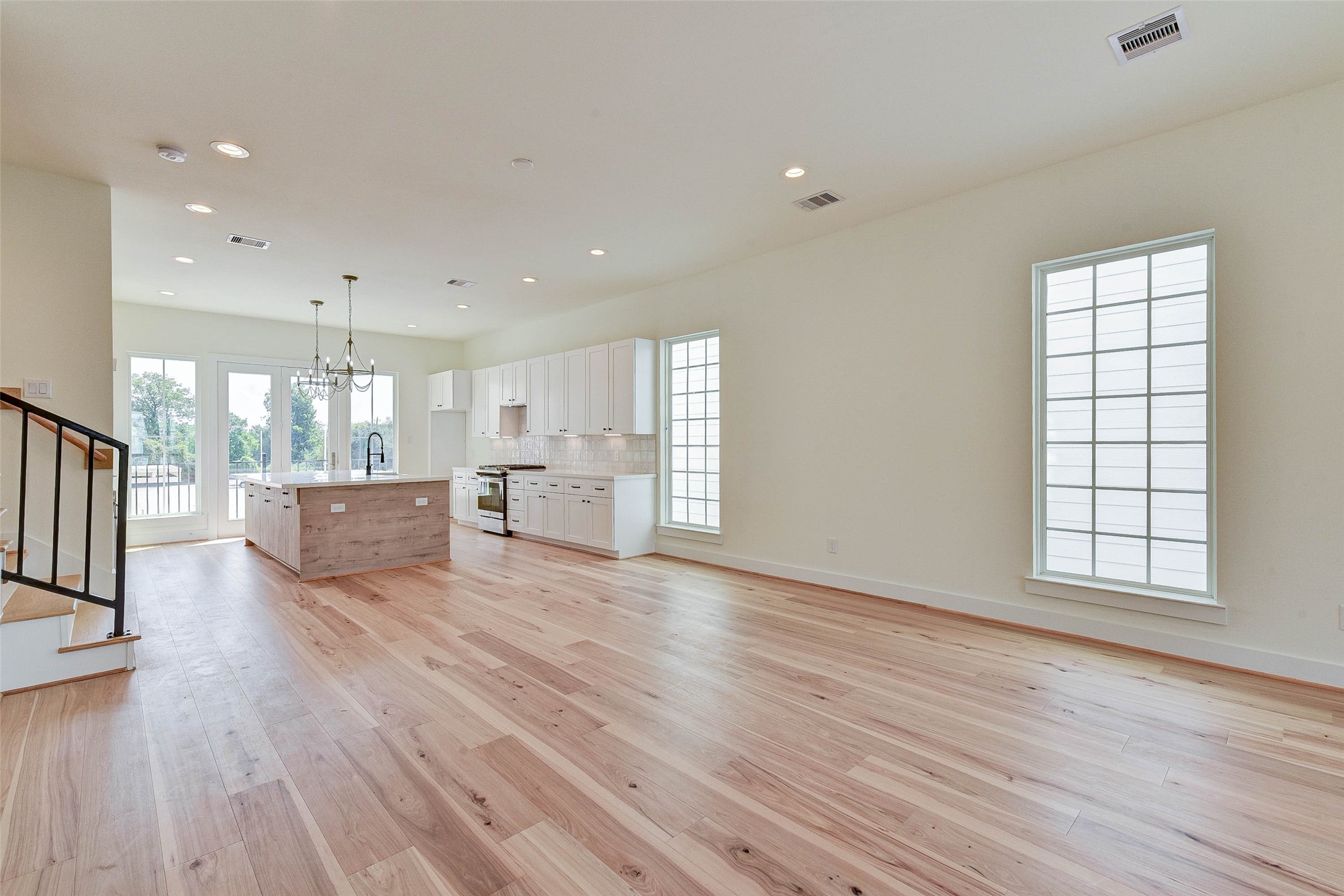 2516 Ohsfeldt Street Houston, TX 77008 - Photo 8 of 24 a view of an empty room with wooden floor and a window