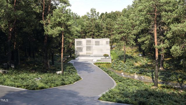 a view of a garden with large trees