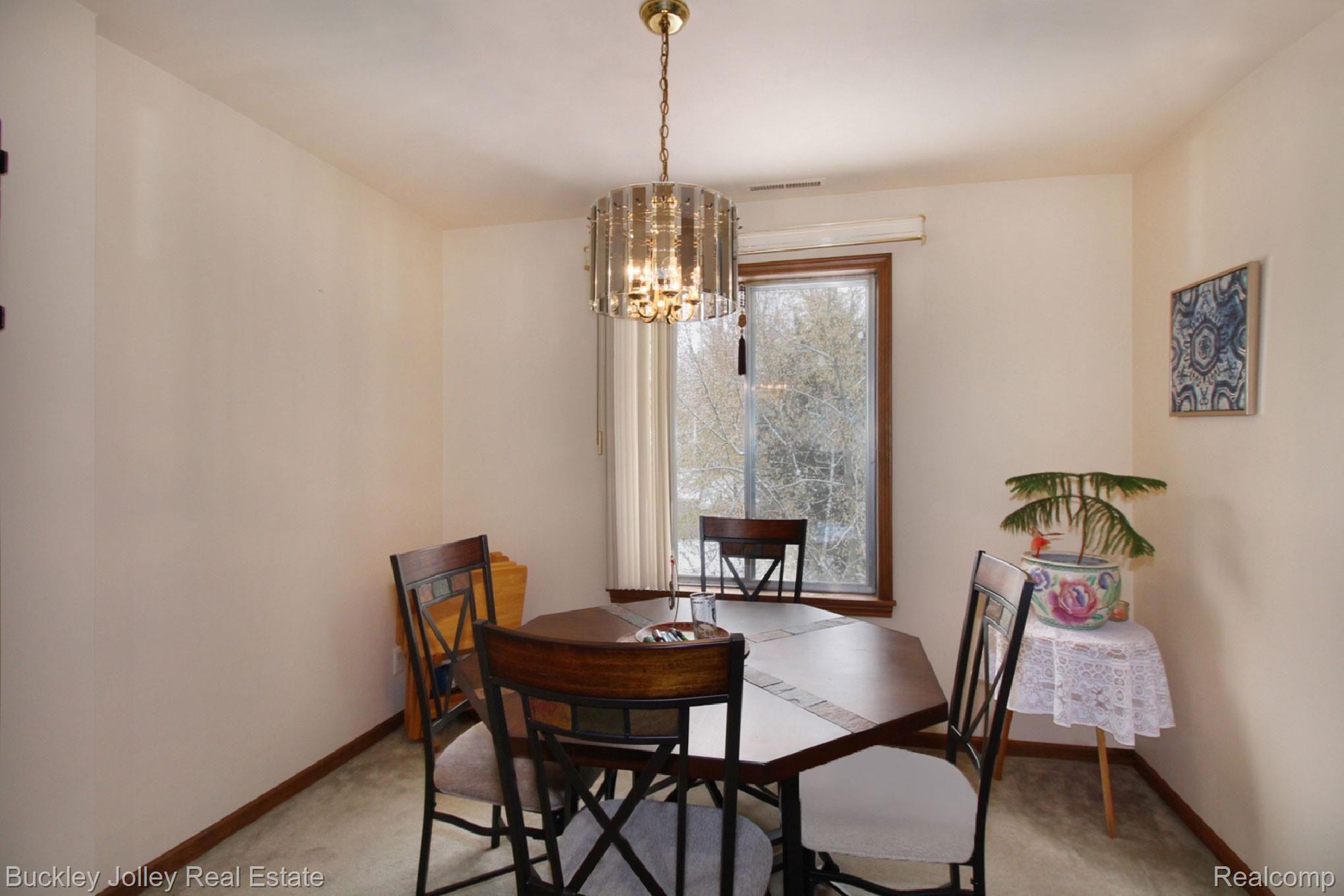 515 West Highland Road, Unit E10 Howell, MI 48843 - Photo 10 of 17 Carpeted Dining Room.jpg