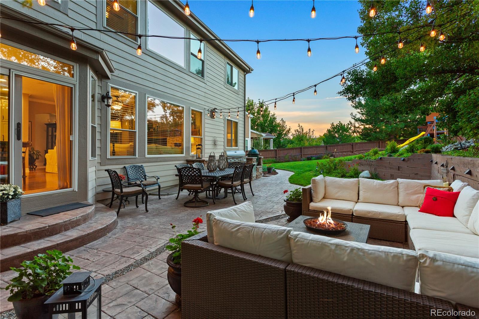 10289 South Dan Court Highlands Ranch, CO 80130 - Photo 12 of 36 a view of a patio with couches table and chairs and potted plants