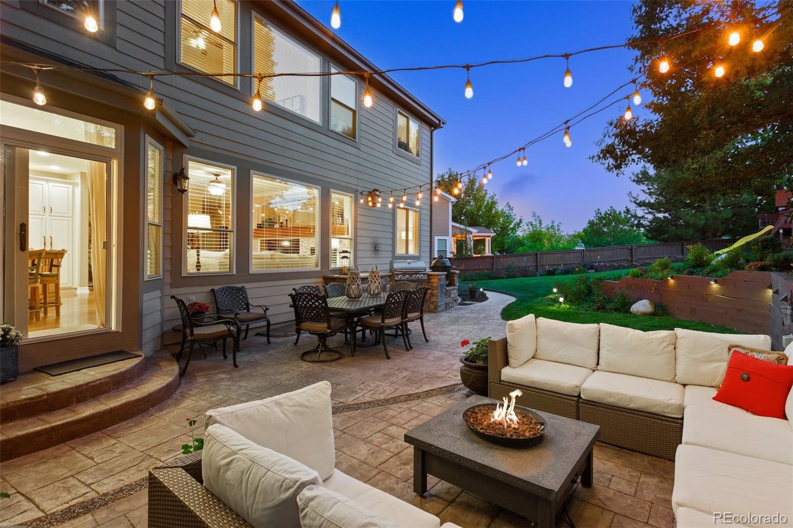 10289 South Dan Court Highlands Ranch, CO 80130 - Photo 2 of 36 a outdoor living space with patio furniture and a potted plant