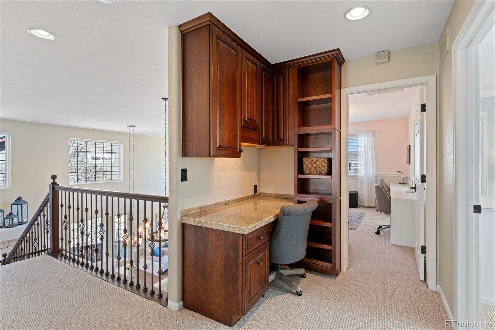 10289 South Dan Court Highlands Ranch, CO 80130 - Photo 25 of 36 a bedroom with a bed and a window