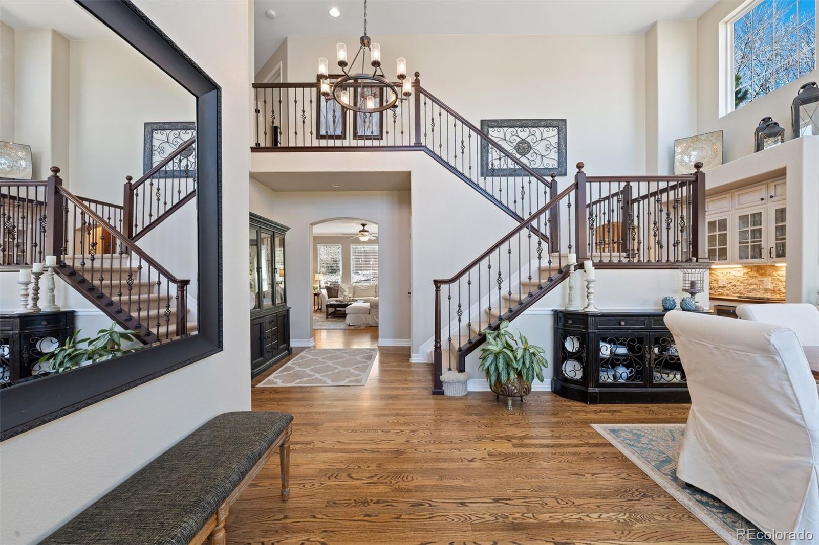 10289 South Dan Court Highlands Ranch, CO 80130 - Photo 3 of 36 a view of entryway and hall with wooden floor