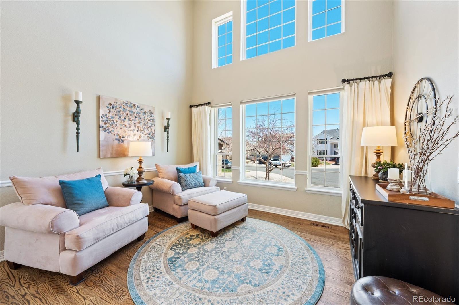 10289 South Dan Court Highlands Ranch, CO 80130 - Photo 4 of 36 a living room with furniture and a large window