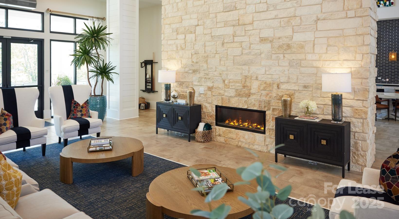 4101 Glenloch Circle, Unit B1 Matthews, NC 28105 - Photo 11 of 28 a living room with furniture and a potted plant