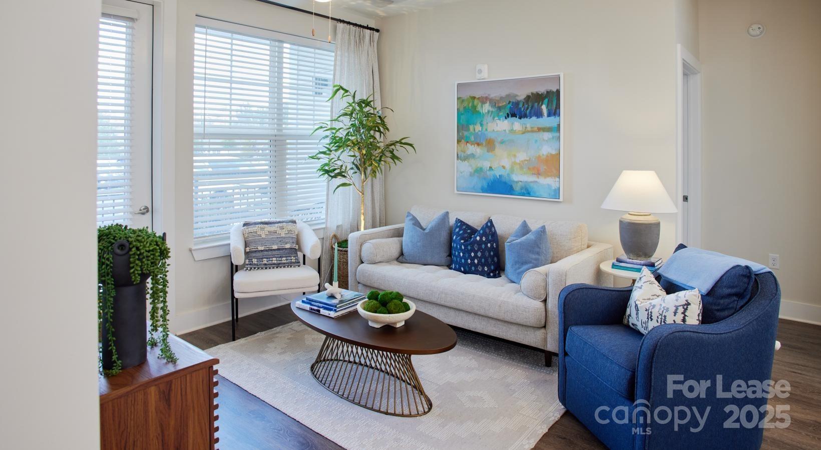 4101 Glenloch Circle, Unit B1 Matthews, NC 28105 - Photo 24 of 28 a living room with furniture potted plant and a window