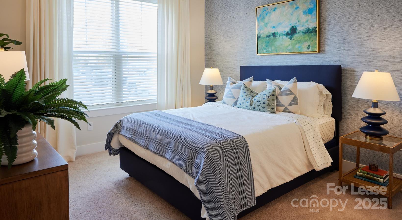 4101 Glenloch Circle, Unit B1 Matthews, NC 28105 - Photo 25 of 28 a spacious bedroom with bed and a potted plant