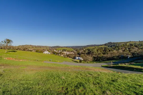 a view of an ocean and a mountain