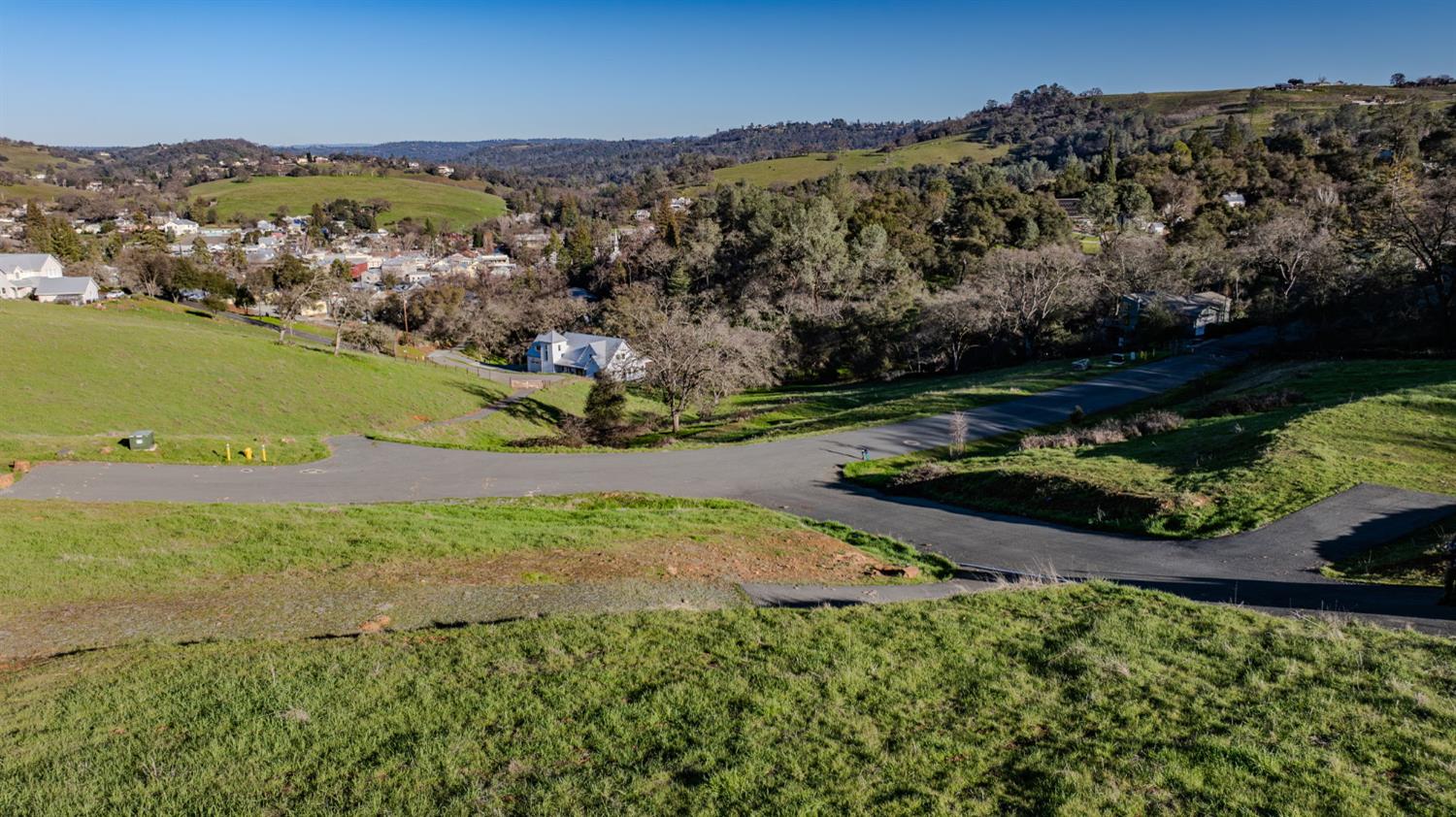 52 David Drive Sutter Creek, CA 95685 - Photo 5 of 10 a view of a lake with a mountain in the background