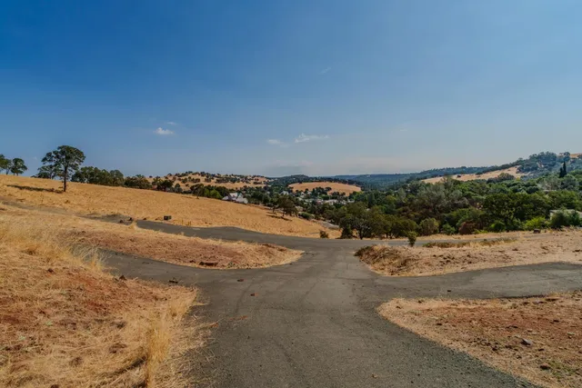 a view of ocean beach and mountain