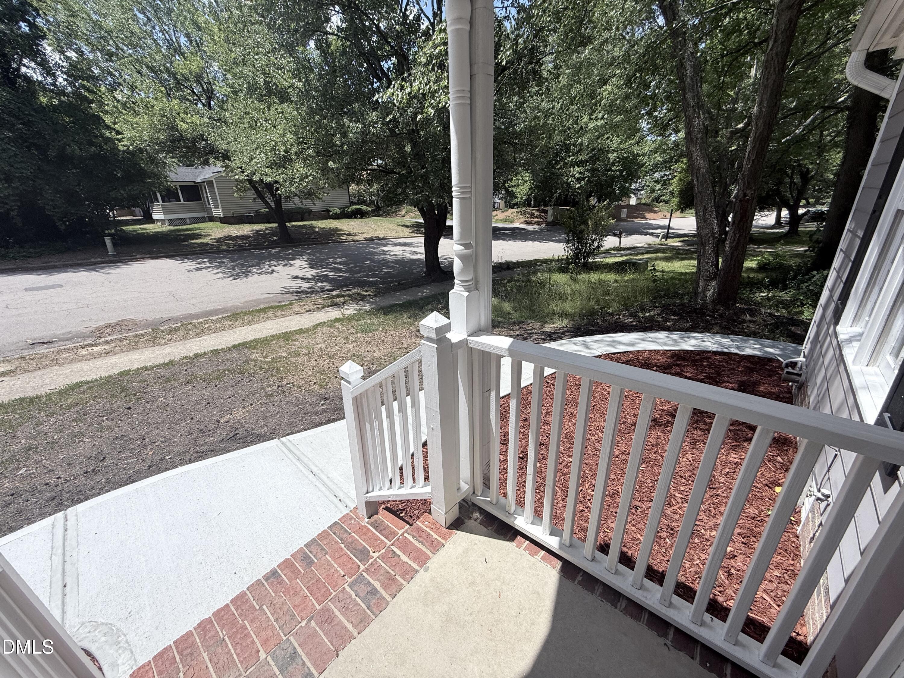 2900 Broadlands Drive Raleigh, NC 27604 - Photo 20 of 60 a view of a backyard with wooden fence