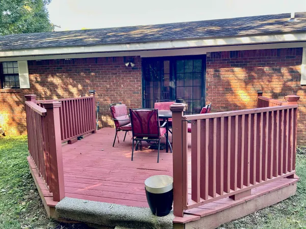 a view of a chair and table in the patio