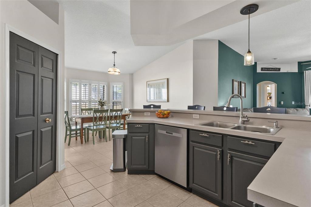 33142 Kaylee Way Leesburg, FL 34788 - Photo 20 of 45 a large kitchen with a table and chairs in it