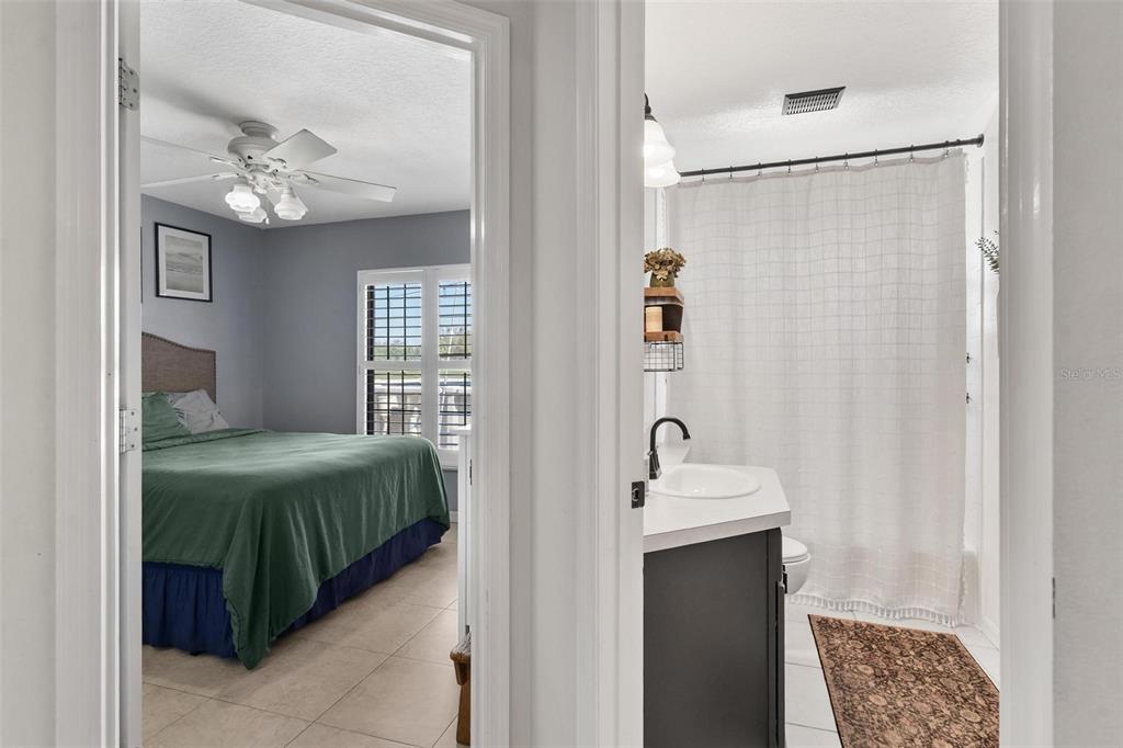 33142 Kaylee Way Leesburg, FL 34788 - Photo 28 of 45 a bedroom with a bed and a window