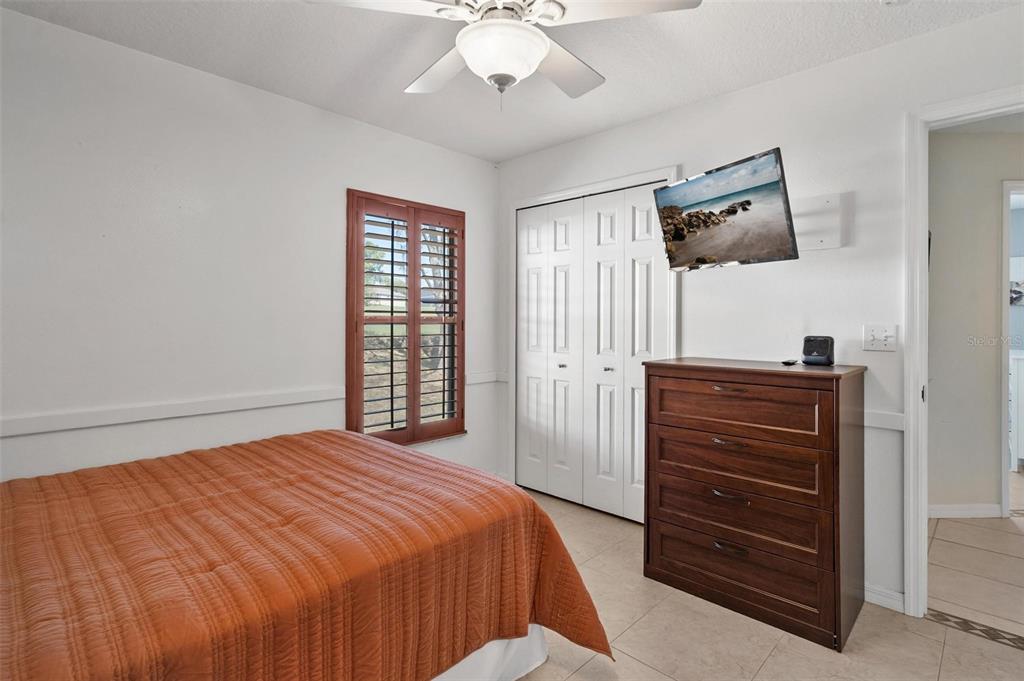 33142 Kaylee Way Leesburg, FL 34788 - Photo 33 of 45 a bedroom with a bed and a dresser