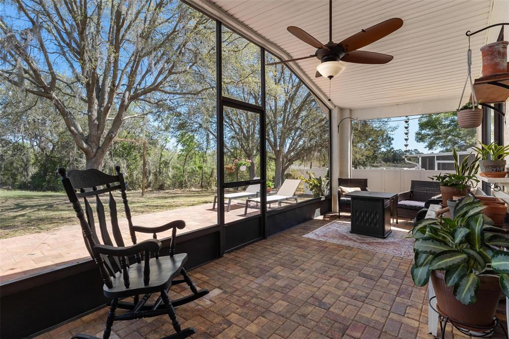 33142 Kaylee Way Leesburg, FL 34788 - Photo 37 of 45 a view of a swimming pool with a table and chairs