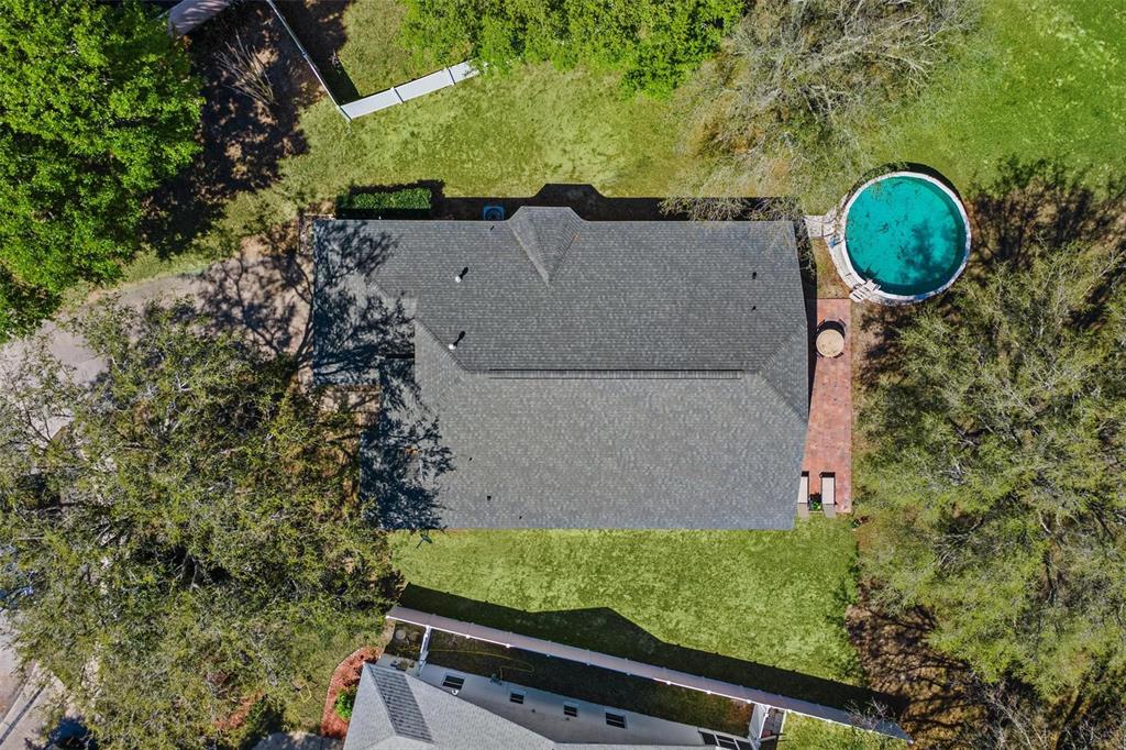 33142 Kaylee Way Leesburg, FL 34788 - Photo 42 of 45 an aerial view of residential house with outdoor space and swimming pool