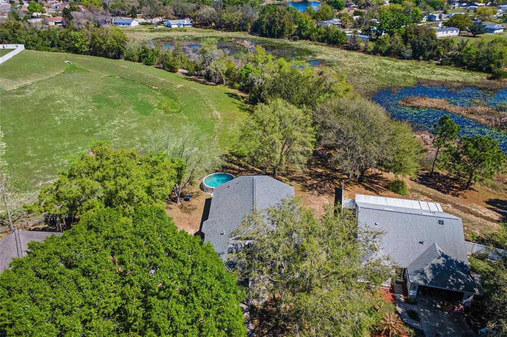 33142 Kaylee Way Leesburg, FL 34788 - Photo 44 of 45 an aerial view of a house with a yard