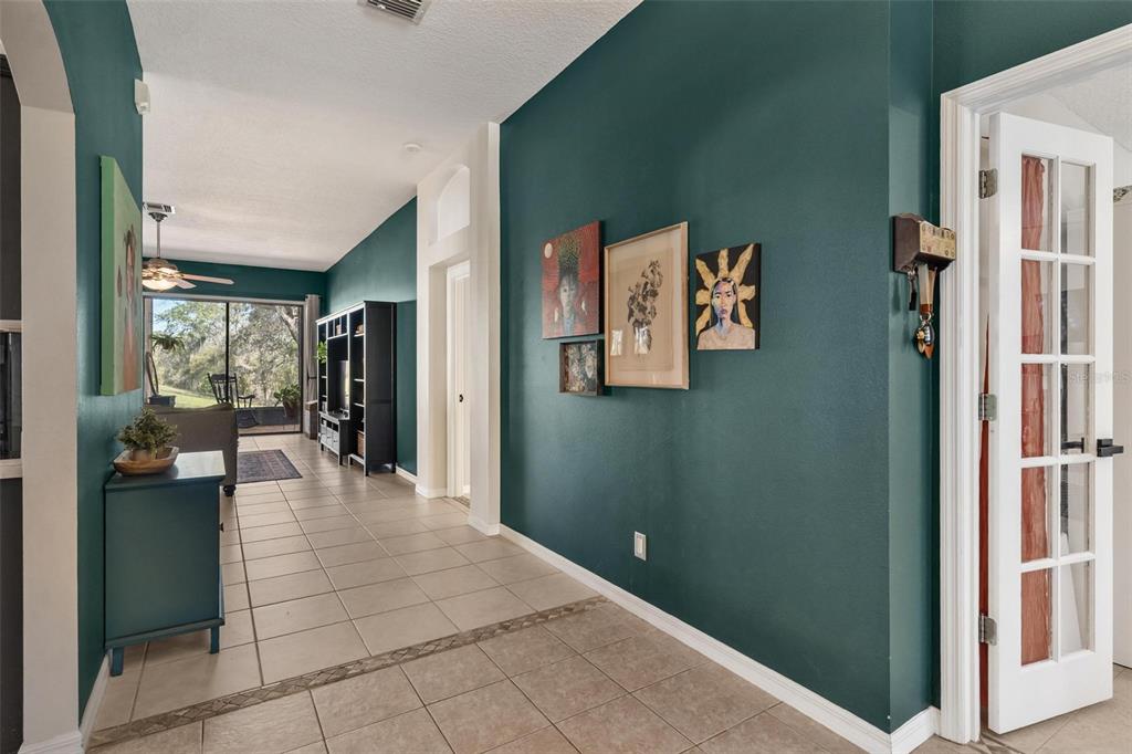 33142 Kaylee Way Leesburg, FL 34788 - Photo 9 of 45 a view of a hallway with a living room