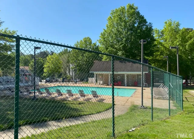 a view of a backyard with a garden and plants