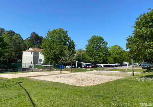 a view of a swimming pool with a yard