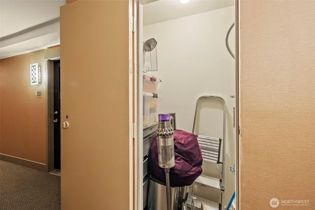 a bathroom with a granite countertop toilet sink and mirror