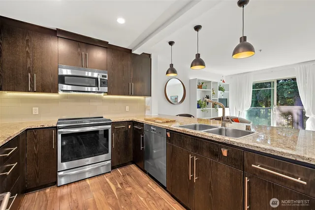 a kitchen with a stove and a sink
