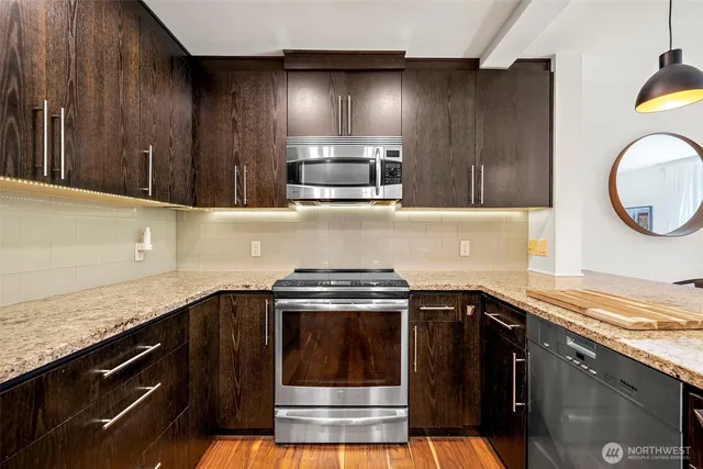 a kitchen with a stove and a microwave