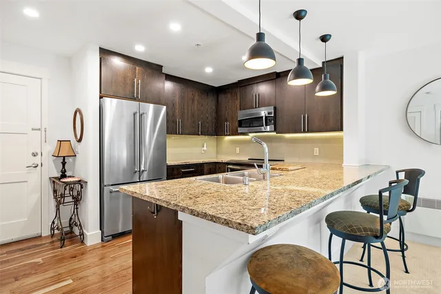 a living room with furniture a front door and a window