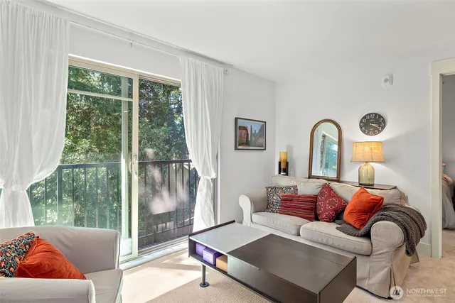 a living room with furniture and a large mirror