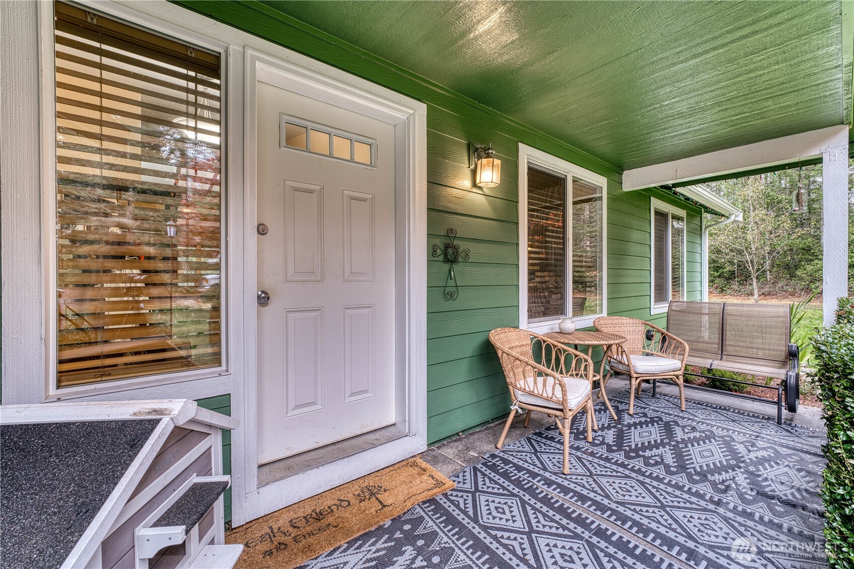 991 Northeast Hurd Road Belfair, WA 98528 - Photo 12 of 40 a outdoor living space with patio furniture and a potted plant