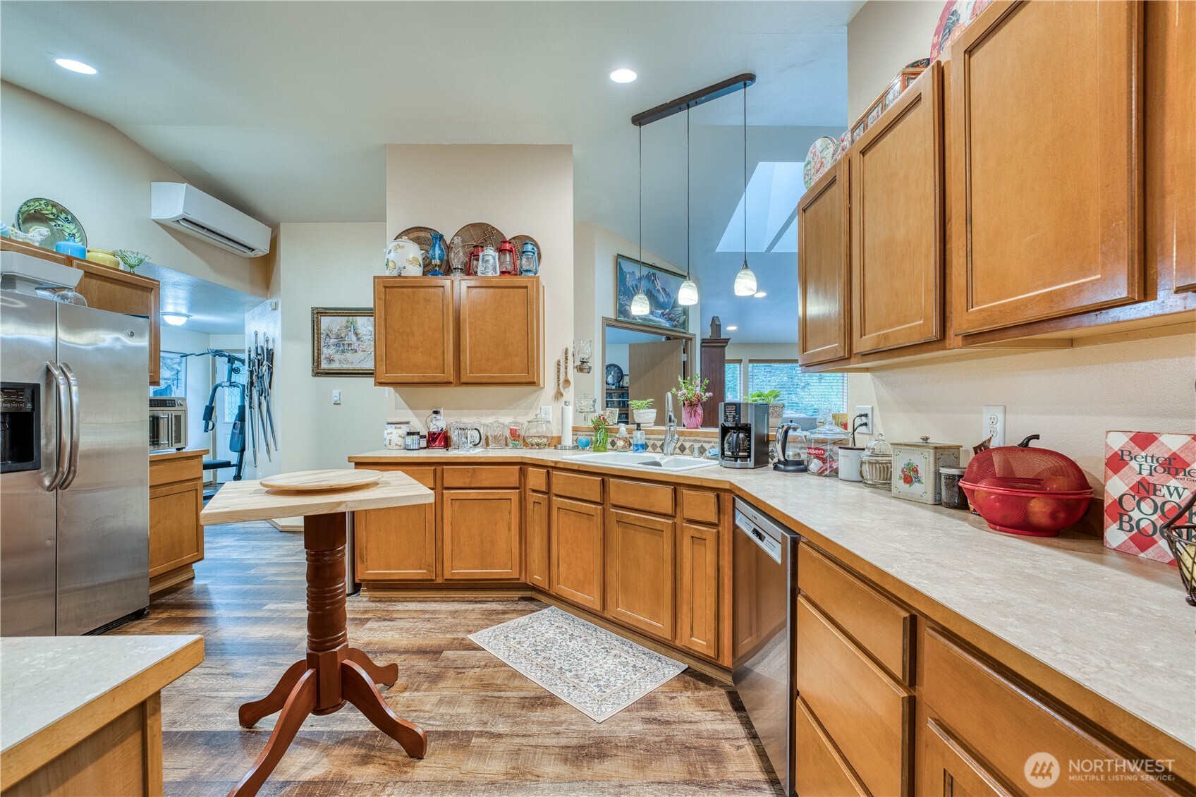 991 Northeast Hurd Road Belfair, WA 98528 - Photo 15 of 40 a kitchen with stainless steel appliances granite countertop a sink and cabinets