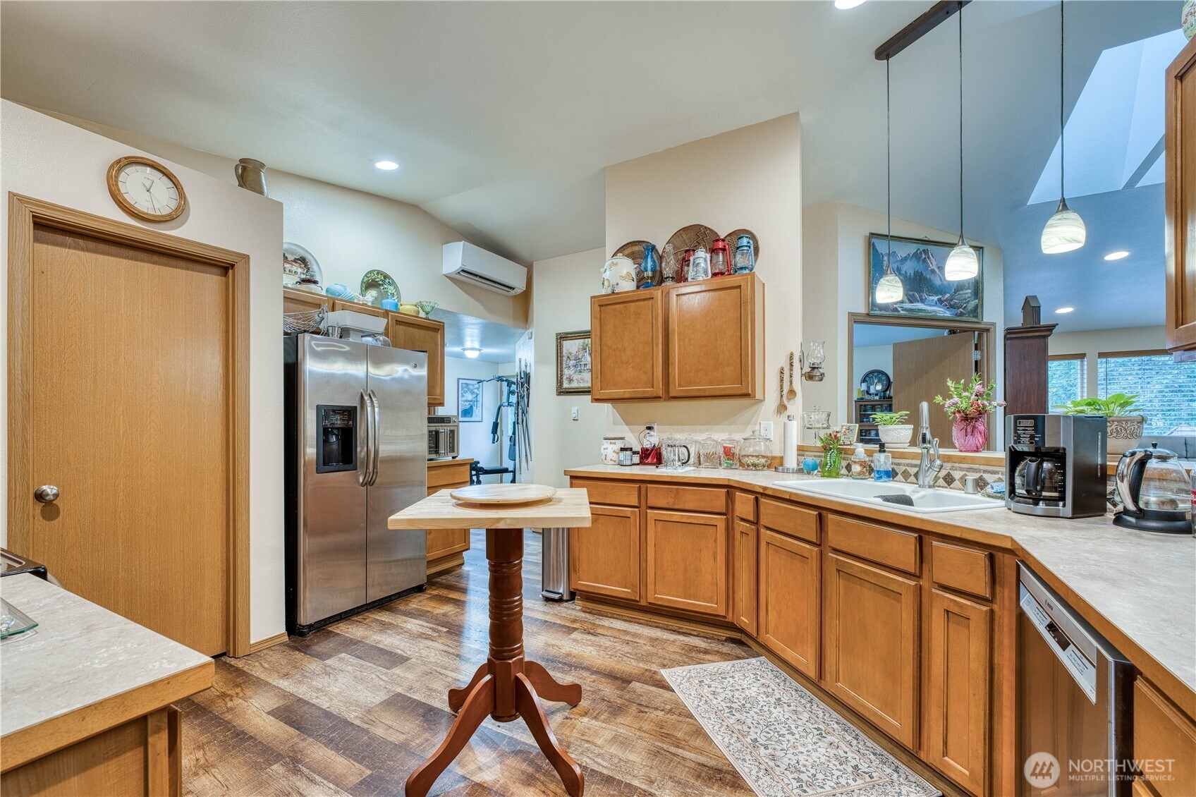 991 Northeast Hurd Road Belfair, WA 98528 - Photo 16 of 40 a kitchen with stainless steel appliances granite countertop a sink and a refrigerator