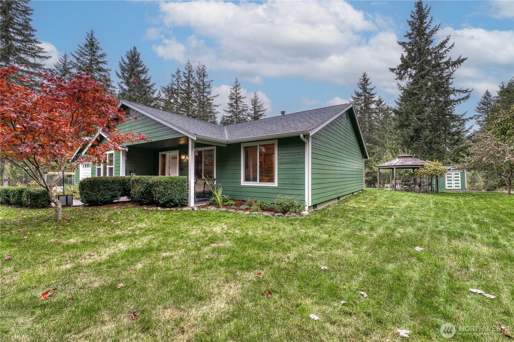 991 Northeast Hurd Road Belfair, WA 98528 - Photo 2 of 40 a view of a house with a backyard