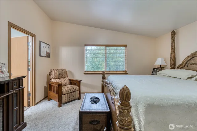 a bedroom with furniture and a window