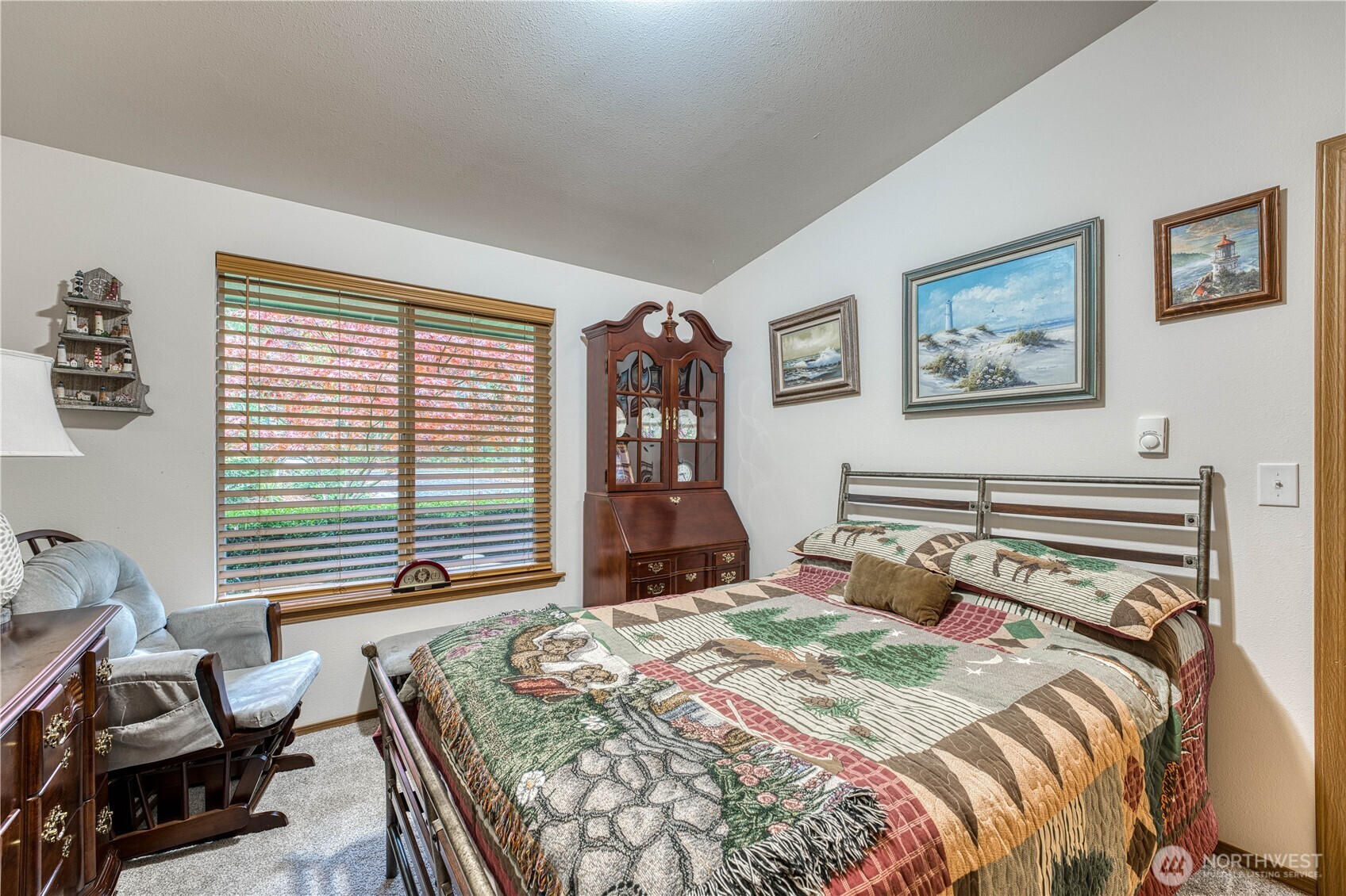 991 Northeast Hurd Road Belfair, WA 98528 - Photo 26 of 40 a bedroom with a bed and wooden floor