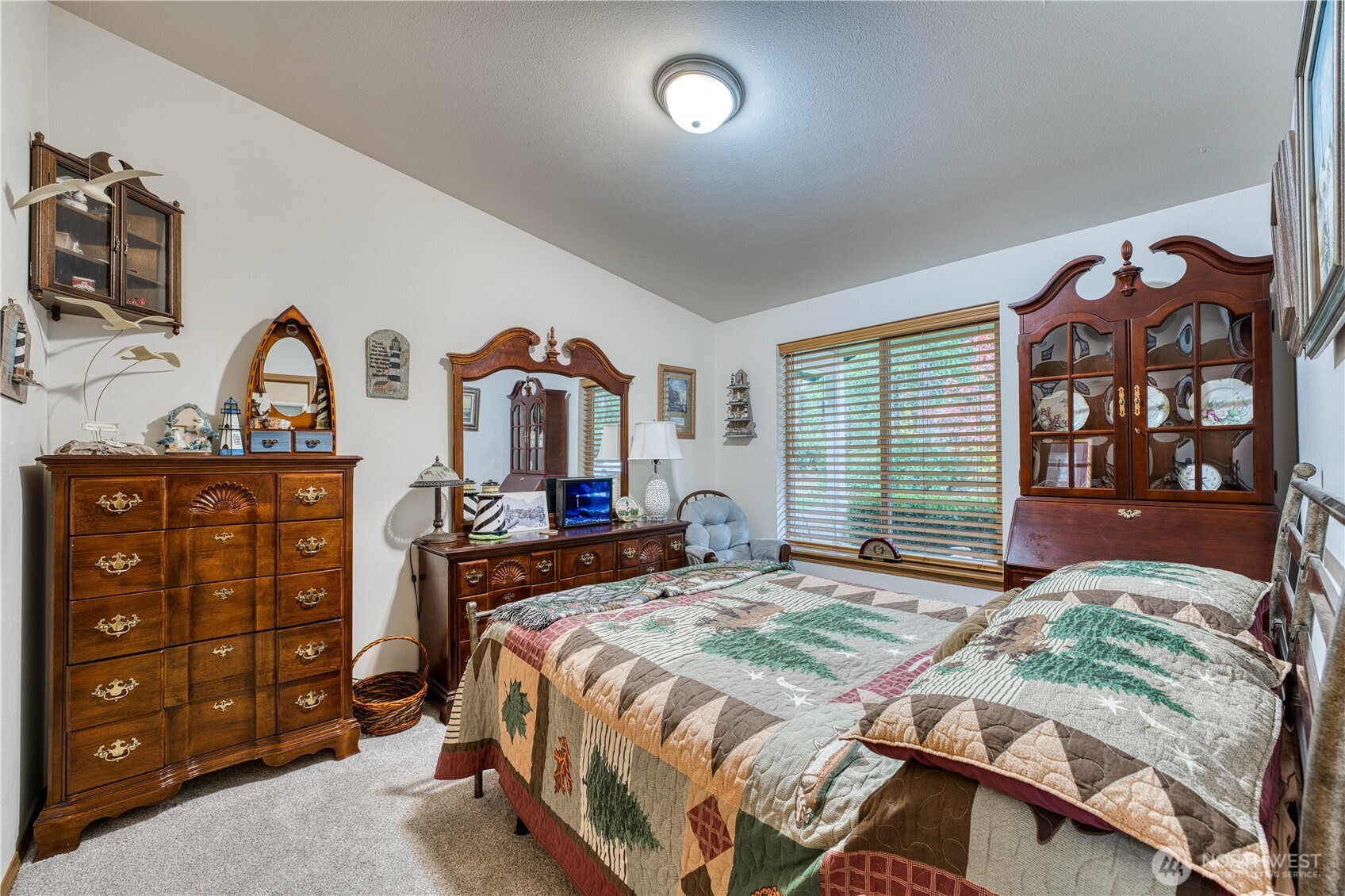 991 Northeast Hurd Road Belfair, WA 98528 - Photo 27 of 40 a bedroom with a bed and a dresser