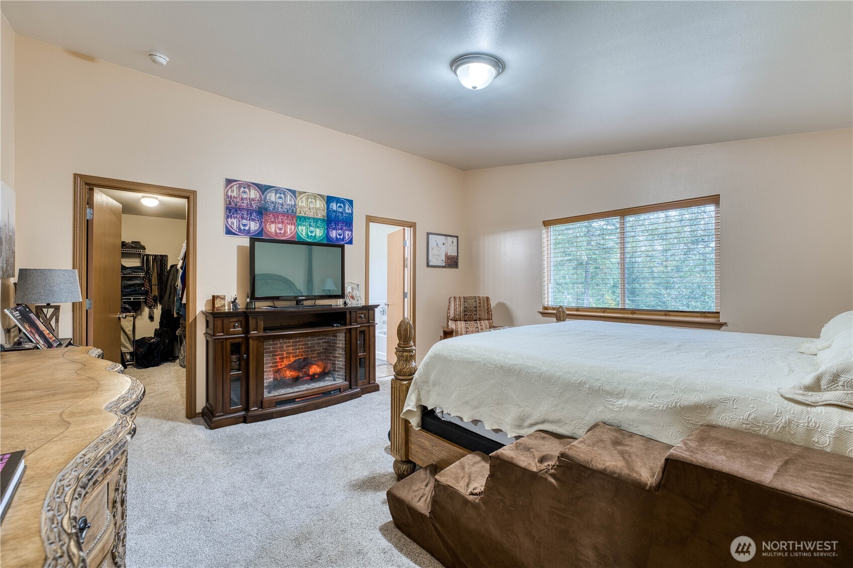 991 Northeast Hurd Road Belfair, WA 98528 - Photo 29 of 40 a bedroom with a bed and a flat screen tv