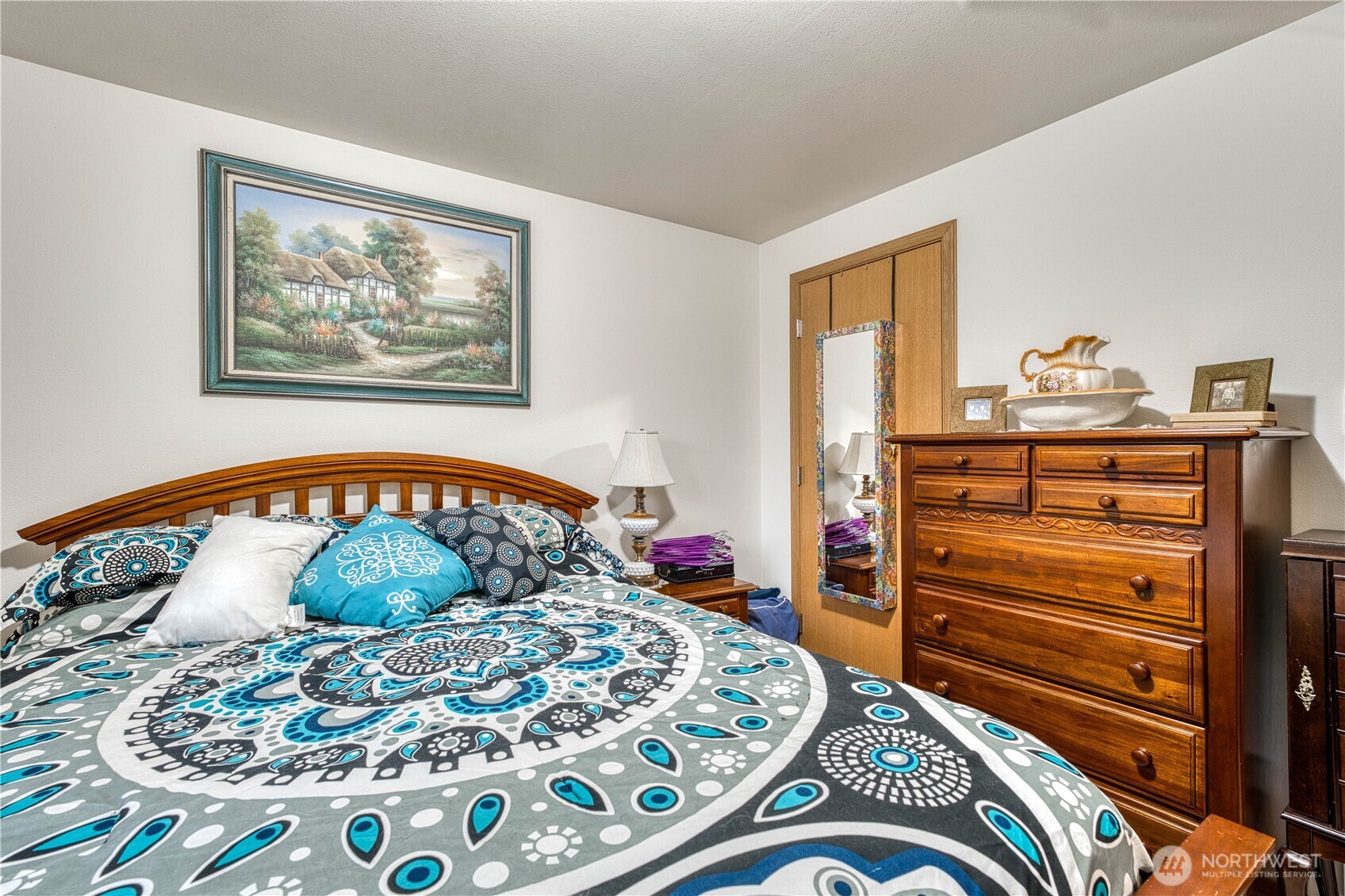 991 Northeast Hurd Road Belfair, WA 98528 - Photo 32 of 40 a bedroom with a bed and cabinets