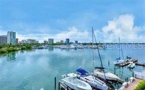 650 Golden Gate Point, Unit 301 Sarasota, FL 34236 - Photo 6 of 31 a view of a lake with sitting area