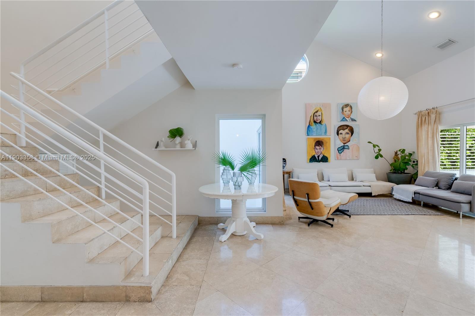 525 Ridgewood Road Key Biscayne, FL 33149 - Photo 1 of 62 a living room with furniture and a chandelier