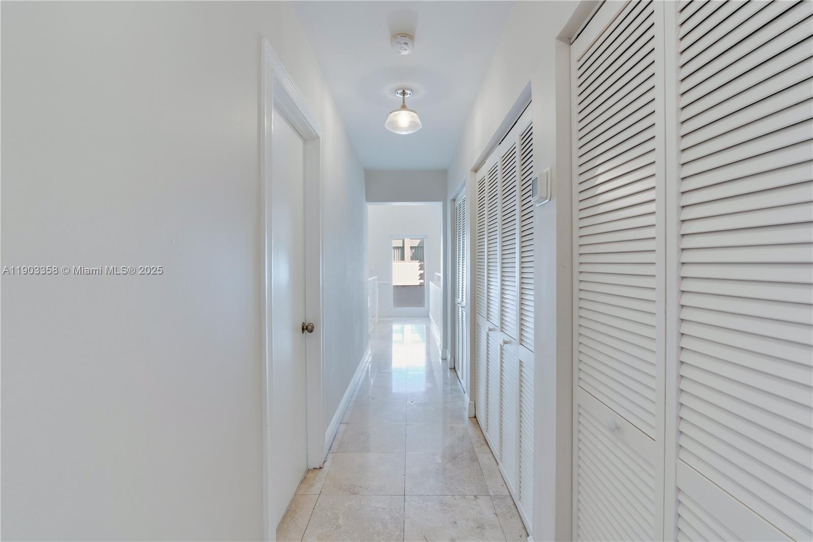 525 Ridgewood Road Key Biscayne, FL 33149 - Photo 12 of 62 a view of a hallway