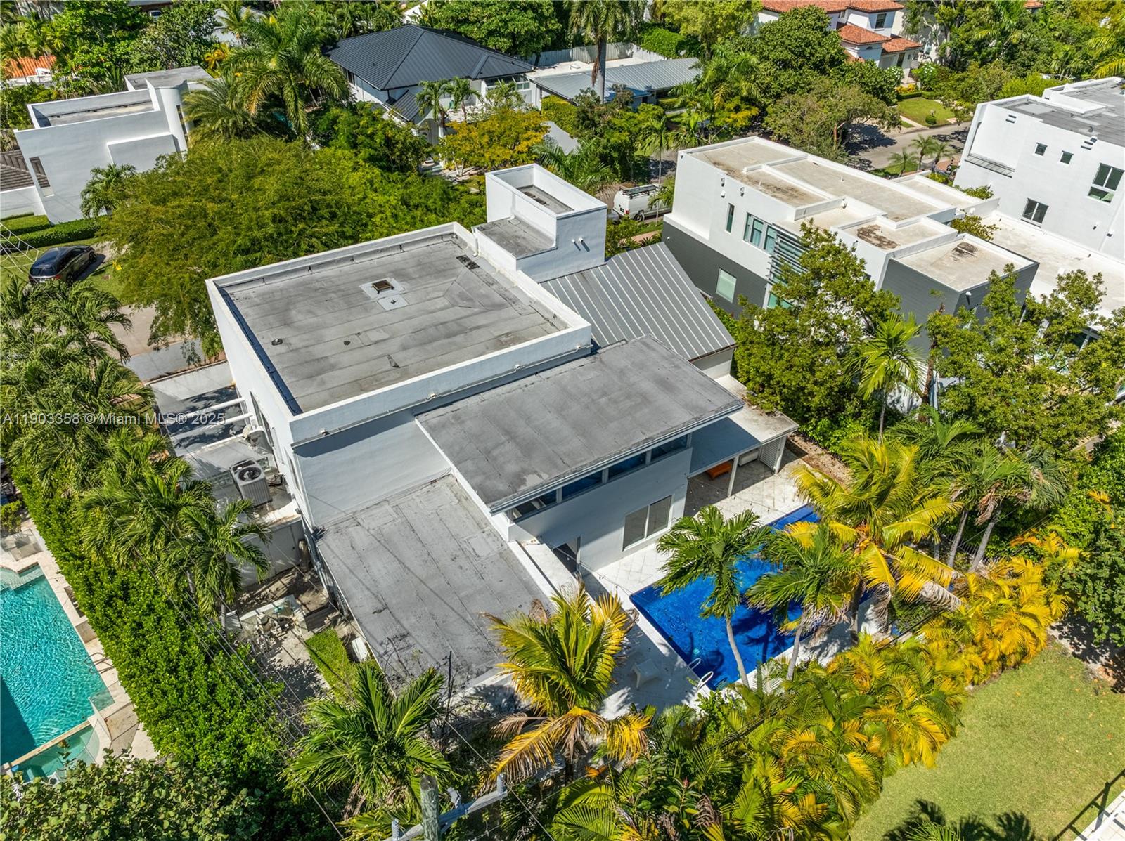 525 Ridgewood Road Key Biscayne, FL 33149 - Photo 19 of 62 an aerial view of a house with a yard and garden