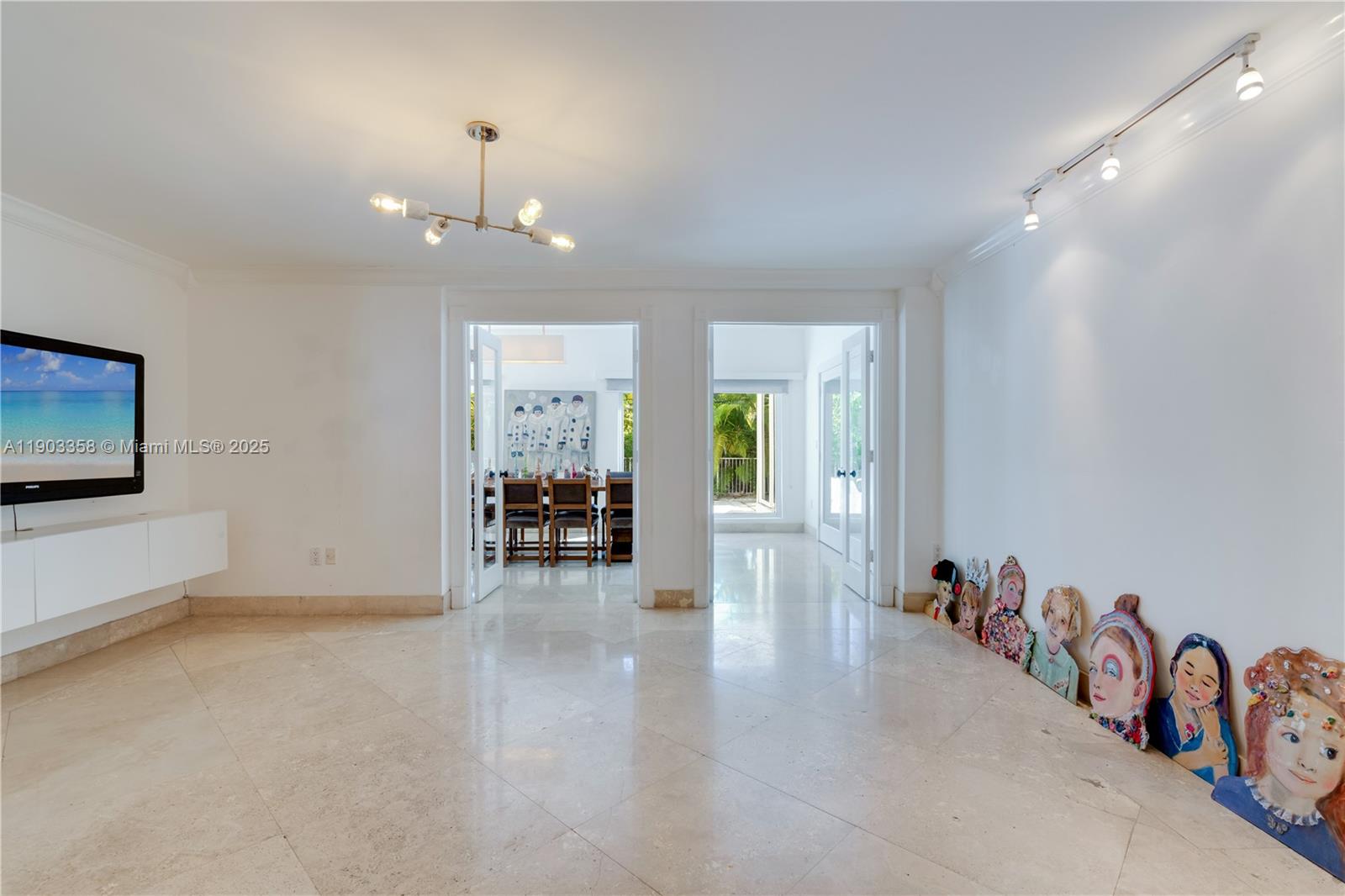 525 Ridgewood Road Key Biscayne, FL 33149 - Photo 33 of 62 a view of a livingroom with a dinning area hardwood floor and a ceiling fan
