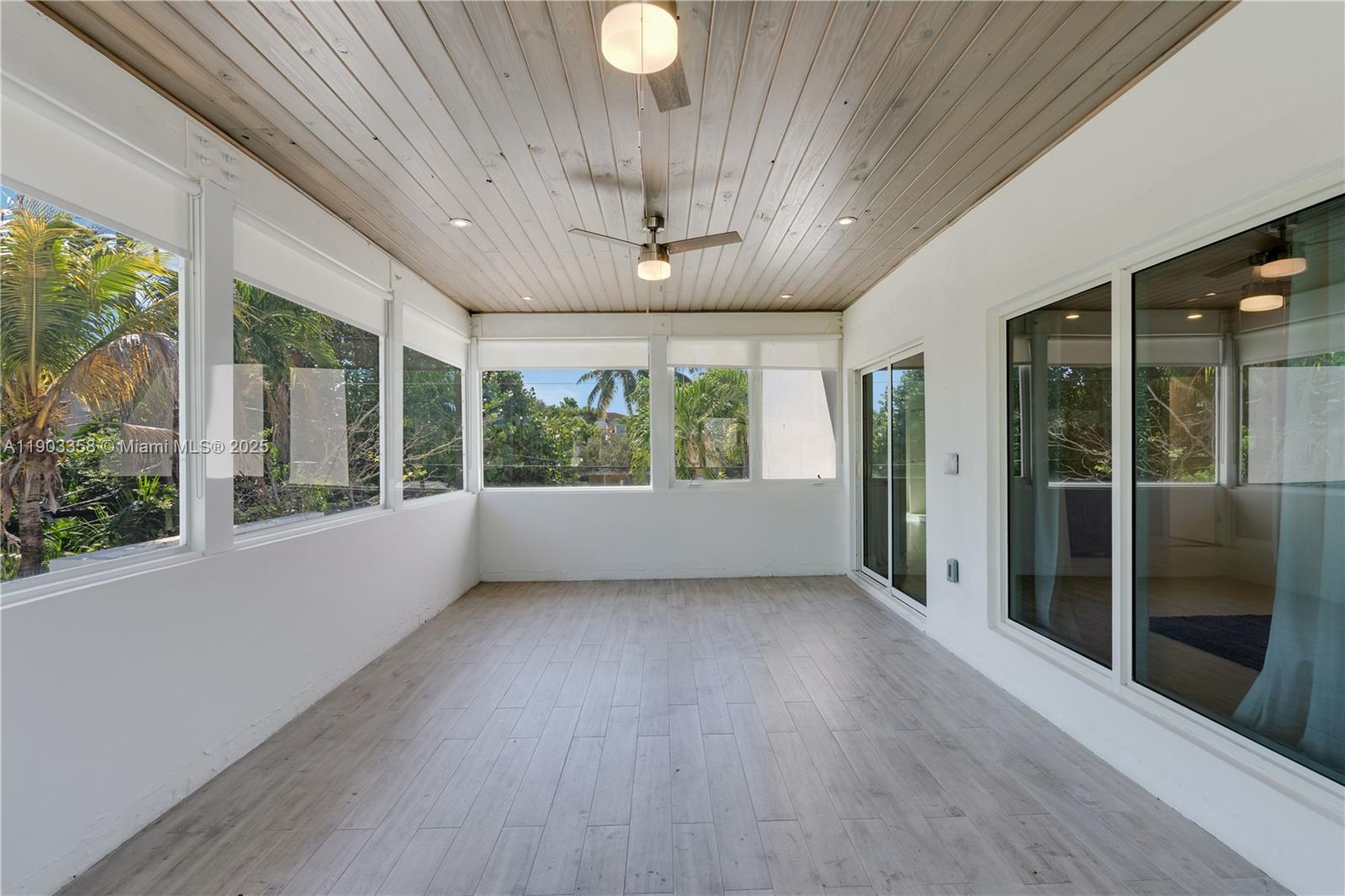 525 Ridgewood Road Key Biscayne, FL 33149 - Photo 47 of 62 a view of an empty room with wooden floor and a window
